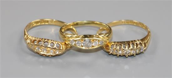 Three 18ct gold and five stone diamond rings including two early 20th century.